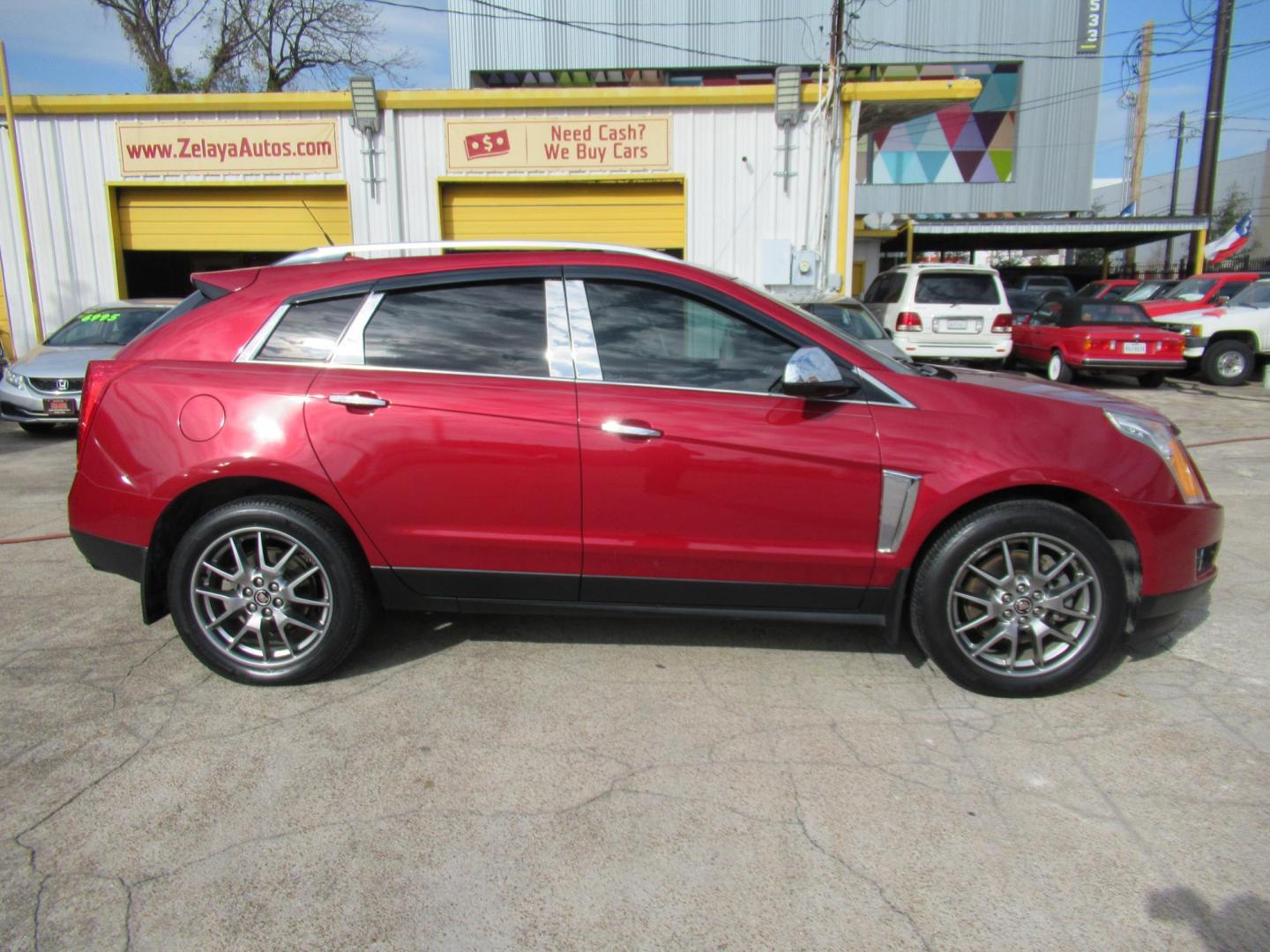 2014 Red /Tan Cadillac SRX Premium Collection FWD (3GYFNDE33ES) with an 3.6L V6 DOHC 24V FFV engine, Automatic transmission, located at 1511 North Shepherd Dr., Houston, TX, 77008, (281) 657-1221, 29.798361, -95.412560 - 2014 CADILLAC SRX PREMIUM COLLECTION VIN: 3GYFNDE33ES567934 3 G Y F N D E 3 3 E S 5 6 7 9 3 4 4 DOOR WAGON/SPORT UTILITY 3.6L V6 F DOHC 24V GASOLINE FRONT WHEEL DRIVE - Photo#0