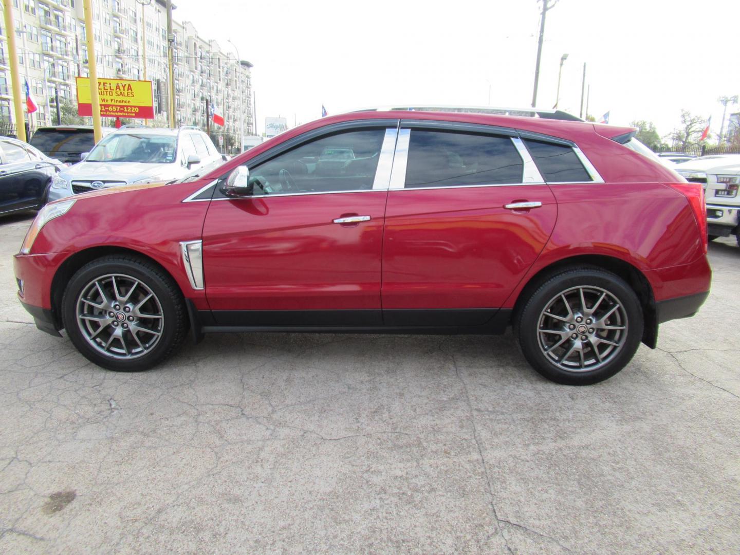 2014 Red /Tan Cadillac SRX Premium Collection FWD (3GYFNDE33ES) with an 3.6L V6 DOHC 24V FFV engine, Automatic transmission, located at 1511 North Shepherd Dr., Houston, TX, 77008, (281) 657-1221, 29.798361, -95.412560 - 2014 CADILLAC SRX PREMIUM COLLECTION VIN: 3GYFNDE33ES567934 3 G Y F N D E 3 3 E S 5 6 7 9 3 4 4 DOOR WAGON/SPORT UTILITY 3.6L V6 F DOHC 24V GASOLINE FRONT WHEEL DRIVE - Photo#16