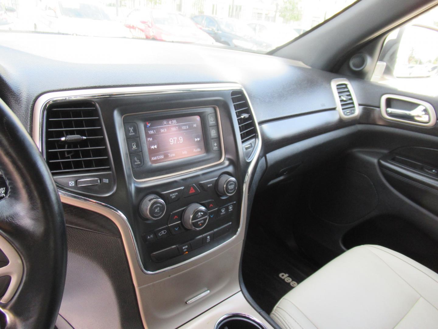 2014 White /Tan Jeep Grand Cherokee Laredo 2WD (1C4RJEAG8EC) with an 3.6L V6 DOHC 24V engine, Automatic transmission, located at 1511 North Shepherd Dr., Houston, TX, 77008, (281) 657-1221, 29.798361, -95.412560 - Photo#3