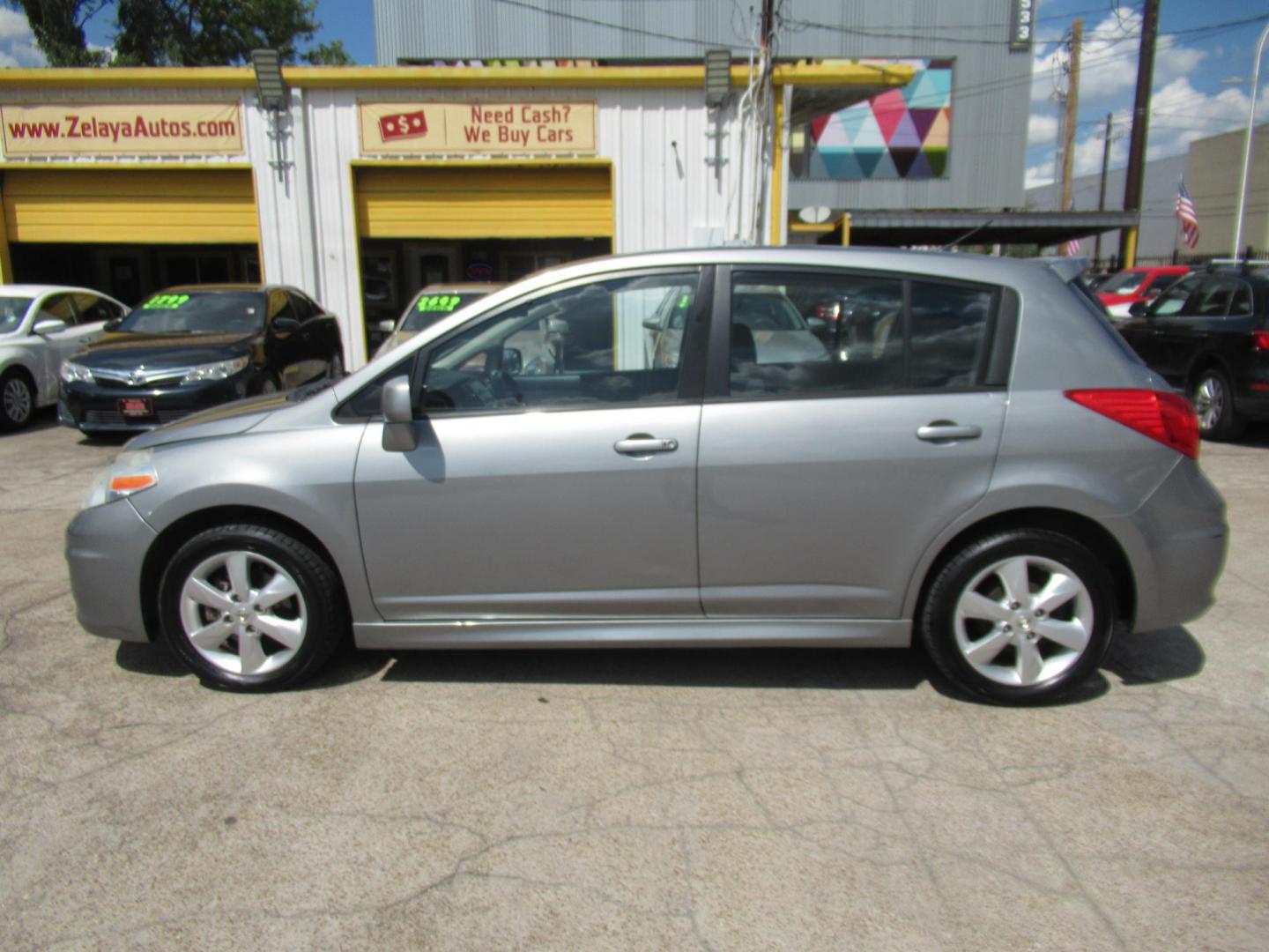 2012 Gray /Black Nissan Versa 1.8 SL Hatchback (3N1BC1CP5CK) with an 1.8L L4 DOHC 16V engine, Continuously Variable Transmission transmission, located at 1511 North Shepherd Dr., Houston, TX, 77008, (281) 657-1221, 29.798361, -95.412560 - 2012 Nissan Versa 1.8 SL Hatchback 1.8L L4 DOHC 16V 4 Cylinder - Photo#0