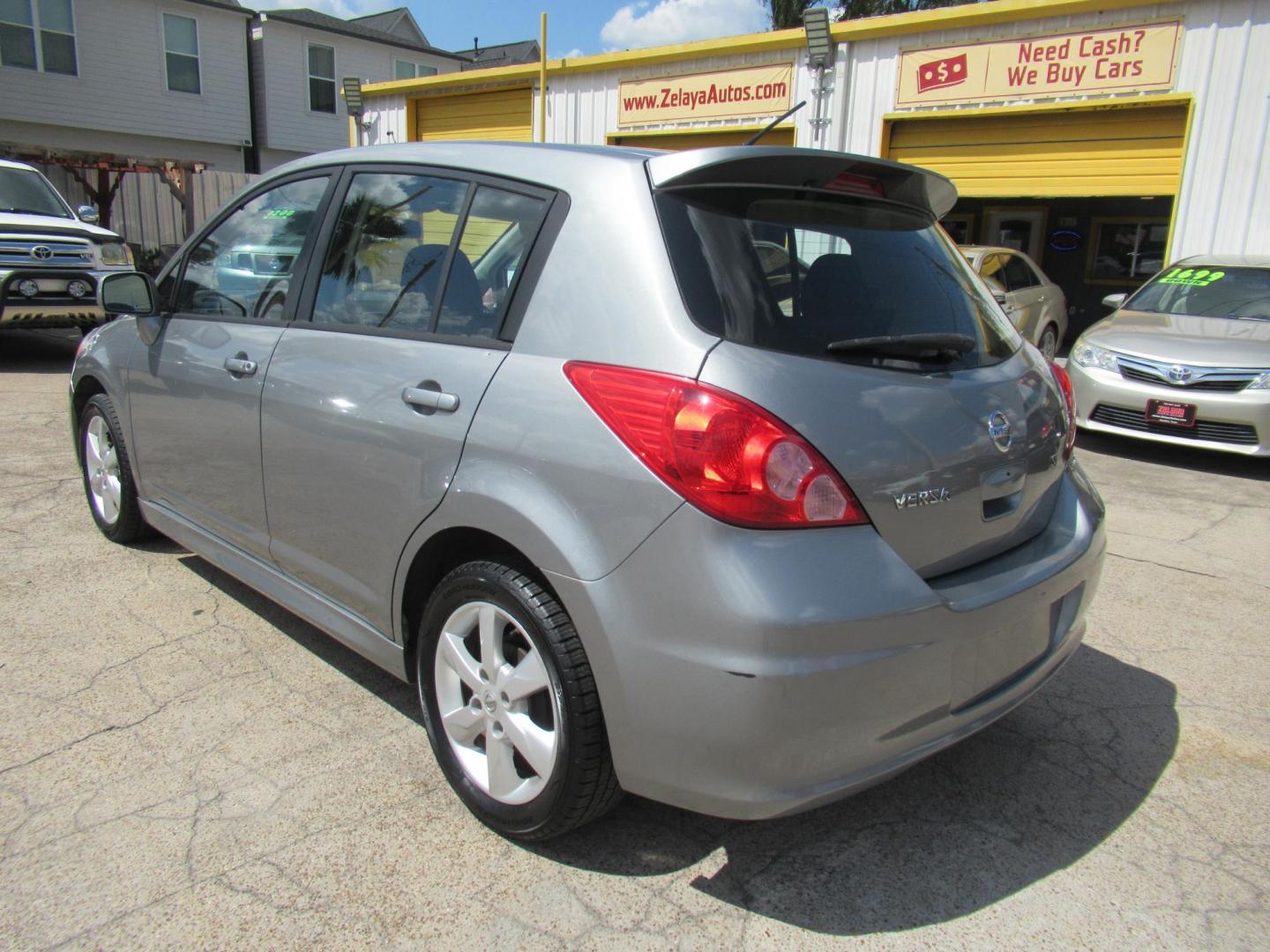 2012 Gray /Black Nissan Versa 1.8 SL Hatchback (3N1BC1CP5CK) with an 1.8L L4 DOHC 16V engine, Continuously Variable Transmission transmission, located at 1511 North Shepherd Dr., Houston, TX, 77008, (281) 657-1221, 29.798361, -95.412560 - 2012 Nissan Versa 1.8 SL Hatchback 1.8L L4 DOHC 16V 4 Cylinder - Photo#18