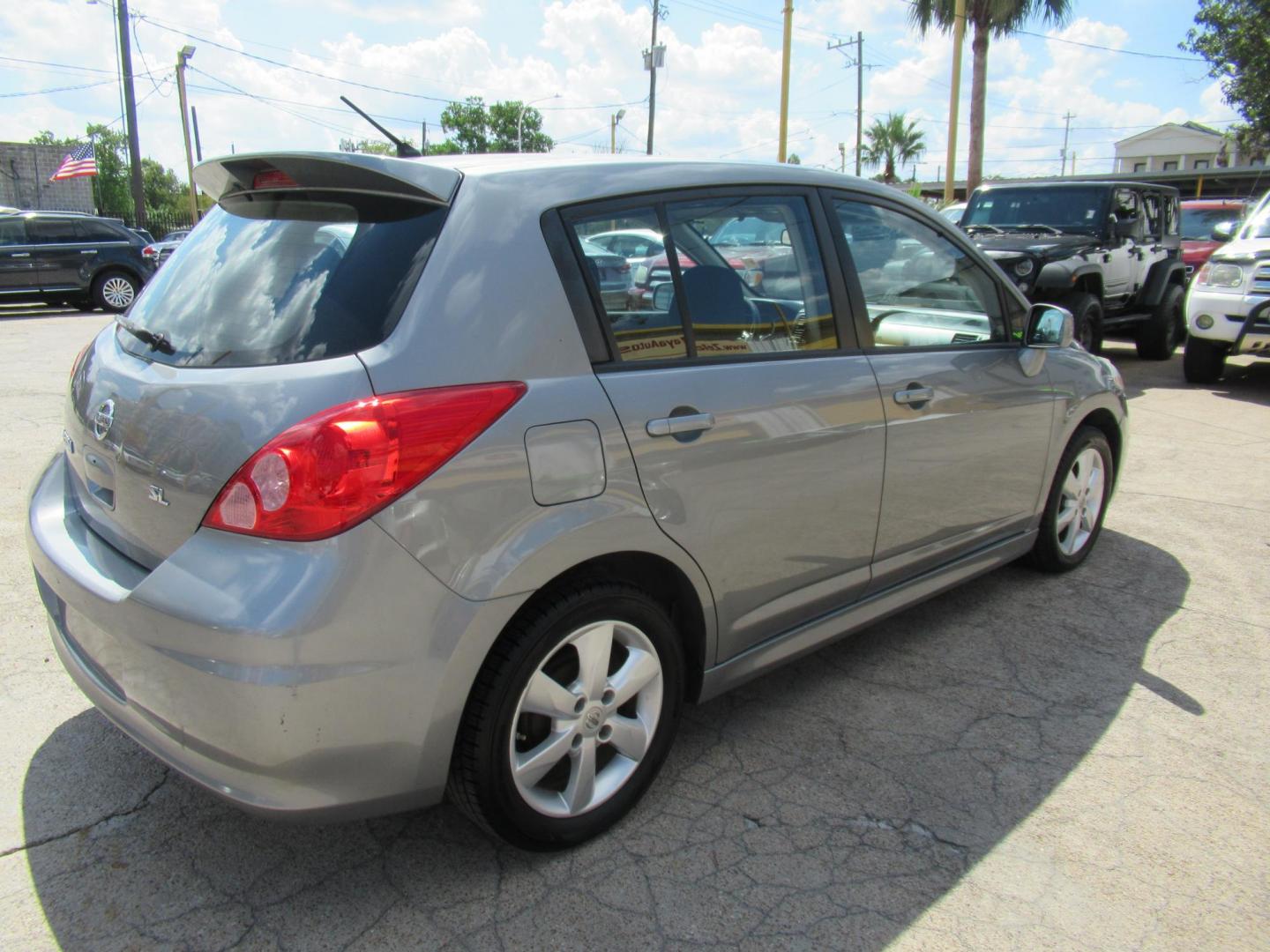 2012 Gray /Black Nissan Versa 1.8 SL Hatchback (3N1BC1CP5CK) with an 1.8L L4 DOHC 16V engine, Continuously Variable Transmission transmission, located at 1511 North Shepherd Dr., Houston, TX, 77008, (281) 657-1221, 29.798361, -95.412560 - 2012 Nissan Versa 1.8 SL Hatchback 1.8L L4 DOHC 16V 4 Cylinder - Photo#20