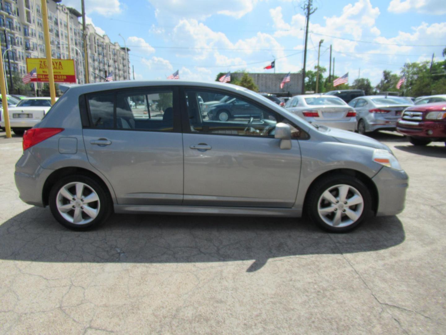 2012 Gray /Black Nissan Versa 1.8 SL Hatchback (3N1BC1CP5CK) with an 1.8L L4 DOHC 16V engine, Continuously Variable Transmission transmission, located at 1511 North Shepherd Dr., Houston, TX, 77008, (281) 657-1221, 29.798361, -95.412560 - 2012 Nissan Versa 1.8 SL Hatchback 1.8L L4 DOHC 16V 4 Cylinder - Photo#21