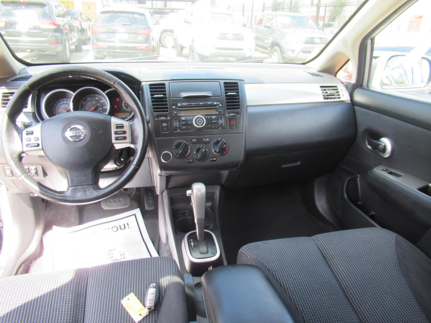 2012 Gray /Black Nissan Versa 1.8 SL Hatchback (3N1BC1CP5CK) with an 1.8L L4 DOHC 16V engine, Continuously Variable Transmission transmission, located at 1511 North Shepherd Dr., Houston, TX, 77008, (281) 657-1221, 29.798361, -95.412560 - 2012 Nissan Versa 1.8 SL Hatchback 1.8L L4 DOHC 16V 4 Cylinder - Photo#9