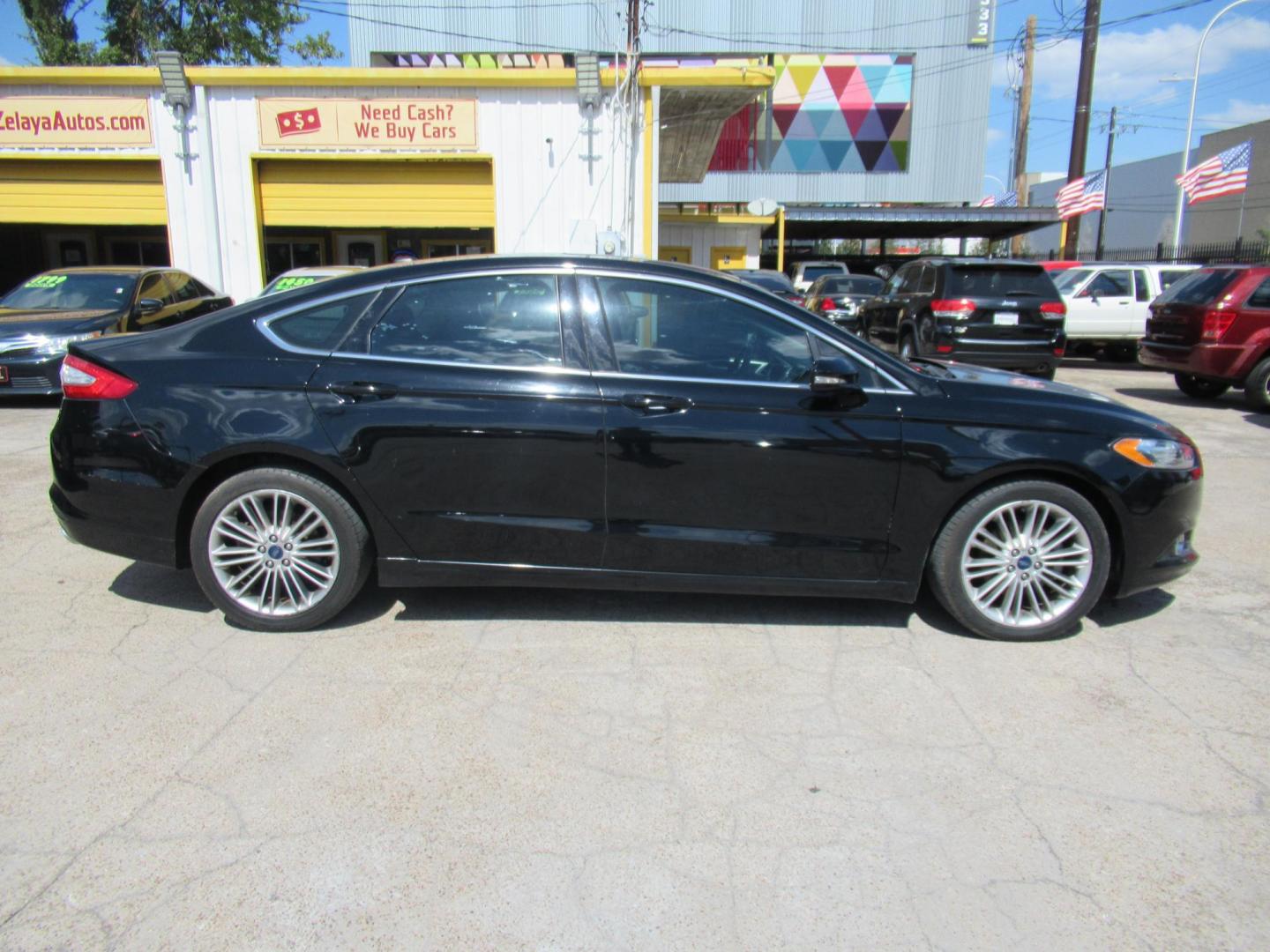 2016 Black /Black Ford Fusion SE (3FA6P0HD2GR) with an 1.5L L4 DOHC 16V engine, Automatic transmission, located at 1511 North Shepherd Dr., Houston, TX, 77008, (281) 657-1221, 29.798361, -95.412560 - 2016 FORD FUSION SE VIN: 3FA6P0HD2GR193264 3 F A 6 P 0 H D 2 G R 1 9 3 2 6 4 SEDAN 4 DR 1.5L I4 F DOHC 16V GASOLINE FRONT WHEEL DRIVE - Photo#0