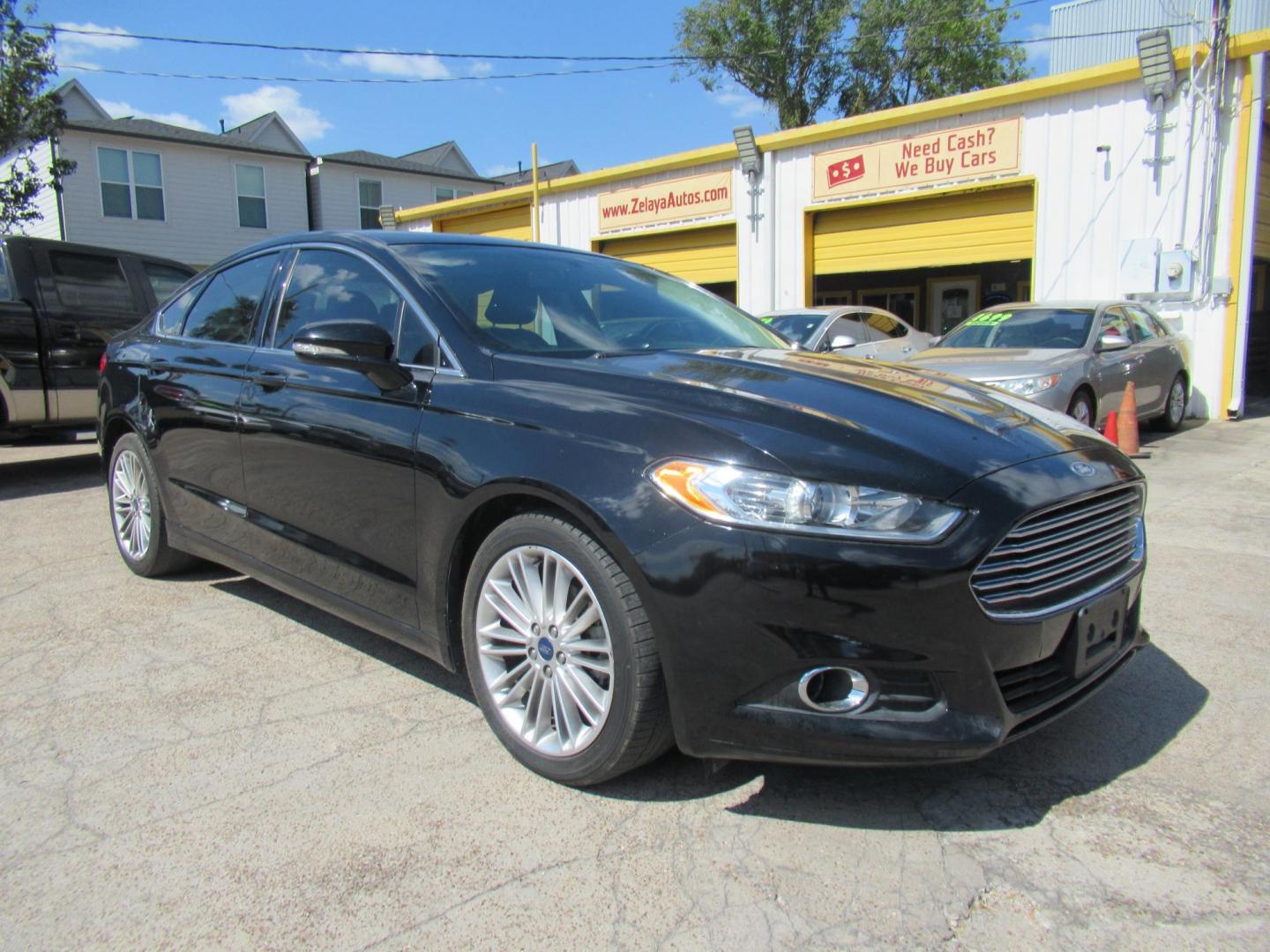 2016 Black /Black Ford Fusion SE (3FA6P0HD2GR) with an 1.5L L4 DOHC 16V engine, Automatic transmission, located at 1511 North Shepherd Dr., Houston, TX, 77008, (281) 657-1221, 29.798361, -95.412560 - 2016 FORD FUSION SE VIN: 3FA6P0HD2GR193264 3 F A 6 P 0 H D 2 G R 1 9 3 2 6 4 SEDAN 4 DR 1.5L I4 F DOHC 16V GASOLINE FRONT WHEEL DRIVE - Photo#18