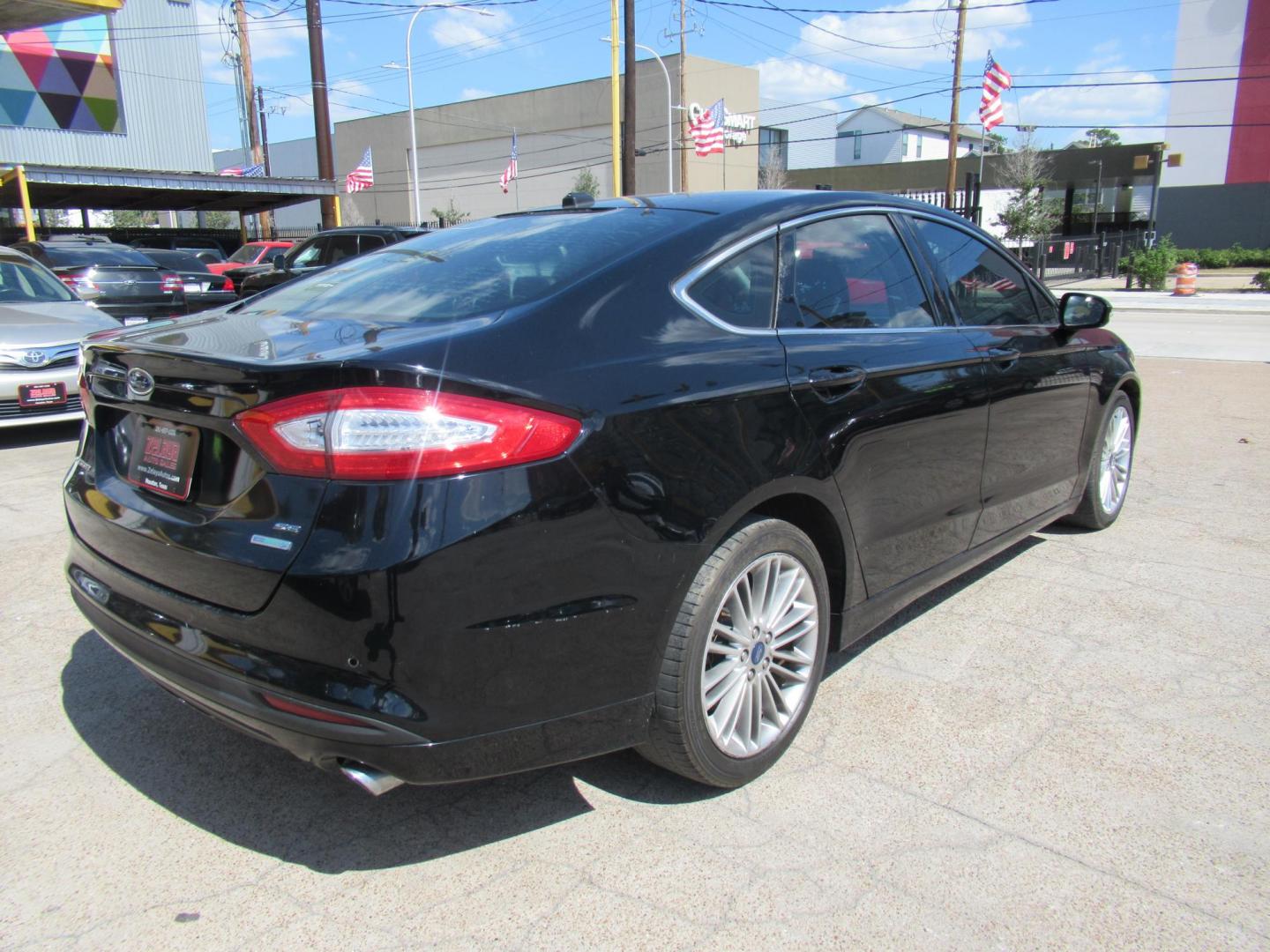 2016 Black /Black Ford Fusion SE (3FA6P0HD2GR) with an 1.5L L4 DOHC 16V engine, Automatic transmission, located at 1511 North Shepherd Dr., Houston, TX, 77008, (281) 657-1221, 29.798361, -95.412560 - 2016 FORD FUSION SE VIN: 3FA6P0HD2GR193264 3 F A 6 P 0 H D 2 G R 1 9 3 2 6 4 SEDAN 4 DR 1.5L I4 F DOHC 16V GASOLINE FRONT WHEEL DRIVE - Photo#21