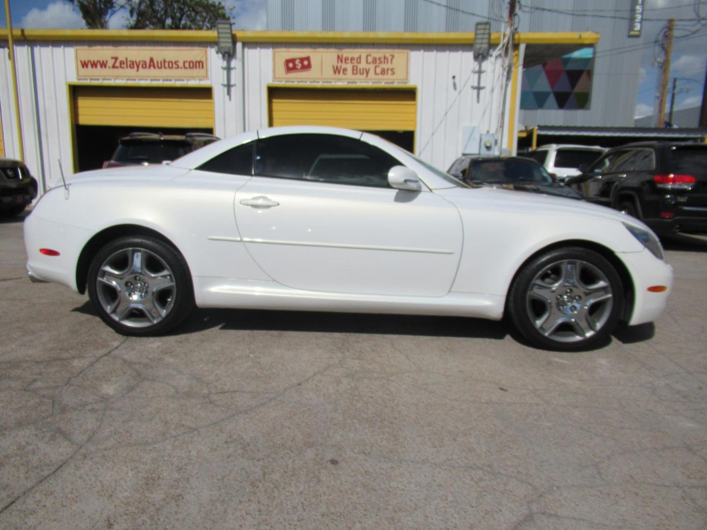 2006 White /Tan Lexus SC 430 Convertible (JTHFN48Y469) with an 4.3L V8 DOHC 32V engine, Automatic Overdrive transmission, located at 1511 North Shepherd Dr., Houston, TX, 77008, (281) 657-1221, 29.798361, -95.412560 - 2006 LEXUS SC 430 VIN: JTHFN48Y469004147 J T H F N 4 8 Y 4 6 9 0 0 4 1 4 7 CONVERTIBLE 4.3L V8 F DOHC 32V GASOLINE REAR WHEEL DRIVE - Photo#0