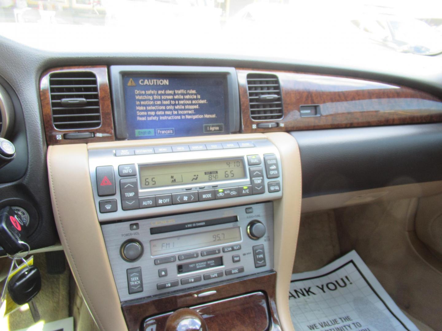 2006 White /Tan Lexus SC 430 Convertible (JTHFN48Y469) with an 4.3L V8 DOHC 32V engine, Automatic Overdrive transmission, located at 1511 North Shepherd Dr., Houston, TX, 77008, (281) 657-1221, 29.798361, -95.412560 - 2006 LEXUS SC 430 VIN: JTHFN48Y469004147 J T H F N 4 8 Y 4 6 9 0 0 4 1 4 7 CONVERTIBLE 4.3L V8 F DOHC 32V GASOLINE REAR WHEEL DRIVE - Photo#13