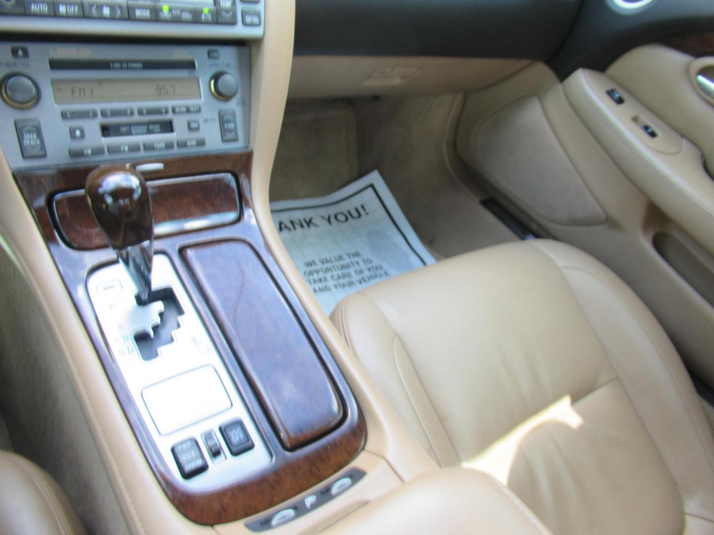 2006 White /Tan Lexus SC 430 Convertible (JTHFN48Y469) with an 4.3L V8 DOHC 32V engine, Automatic Overdrive transmission, located at 1511 North Shepherd Dr., Houston, TX, 77008, (281) 657-1221, 29.798361, -95.412560 - 2006 LEXUS SC 430 VIN: JTHFN48Y469004147 J T H F N 4 8 Y 4 6 9 0 0 4 1 4 7 CONVERTIBLE 4.3L V8 F DOHC 32V GASOLINE REAR WHEEL DRIVE - Photo#14