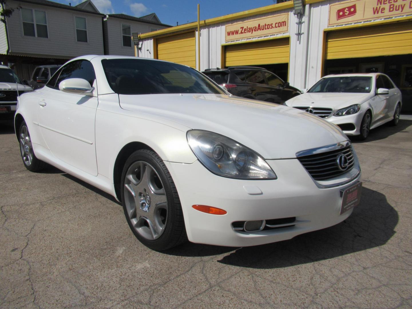 2006 White /Tan Lexus SC 430 Convertible (JTHFN48Y469) with an 4.3L V8 DOHC 32V engine, Automatic Overdrive transmission, located at 1511 North Shepherd Dr., Houston, TX, 77008, (281) 657-1221, 29.798361, -95.412560 - 2006 LEXUS SC 430 VIN: JTHFN48Y469004147 J T H F N 4 8 Y 4 6 9 0 0 4 1 4 7 CONVERTIBLE 4.3L V8 F DOHC 32V GASOLINE REAR WHEEL DRIVE - Photo#21