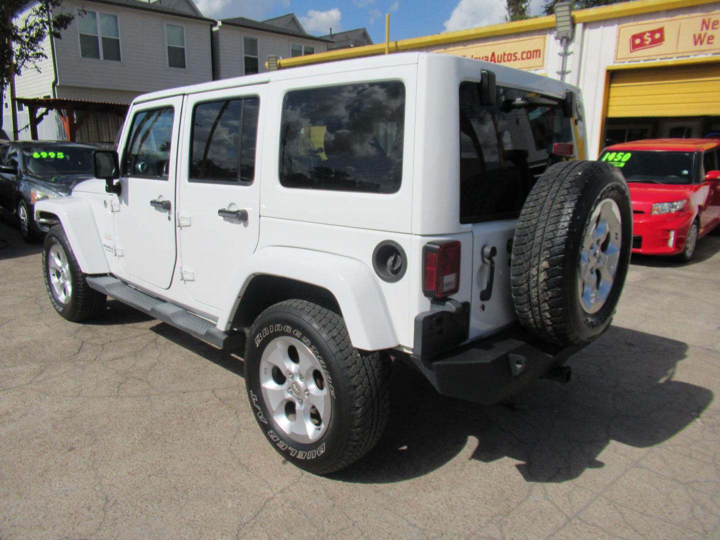 2013 White /Brown Jeep Wrangler Unlimited Sahara 4WD (1C4HJWEG7DL) with an 3.6L V6 DOHC 24V FFV engine, Automatic transmission, located at 1511 North Shepherd Dr., Houston, TX, 77008, (281) 657-1221, 29.798361, -95.412560 - 2013 JEEP WRANGLER UNLIMITED SAHARA VIN: 1C4HJWEG7DL579209 1 C 4 H J W E G 7 D L 5 7 9 2 0 9 4 DOOR WAGON/SPORT UTILITY 3.6L V6 F DOHC 24V GASOLINE REAR WHEEL DRIVE W/ 4X4 - Photo#10