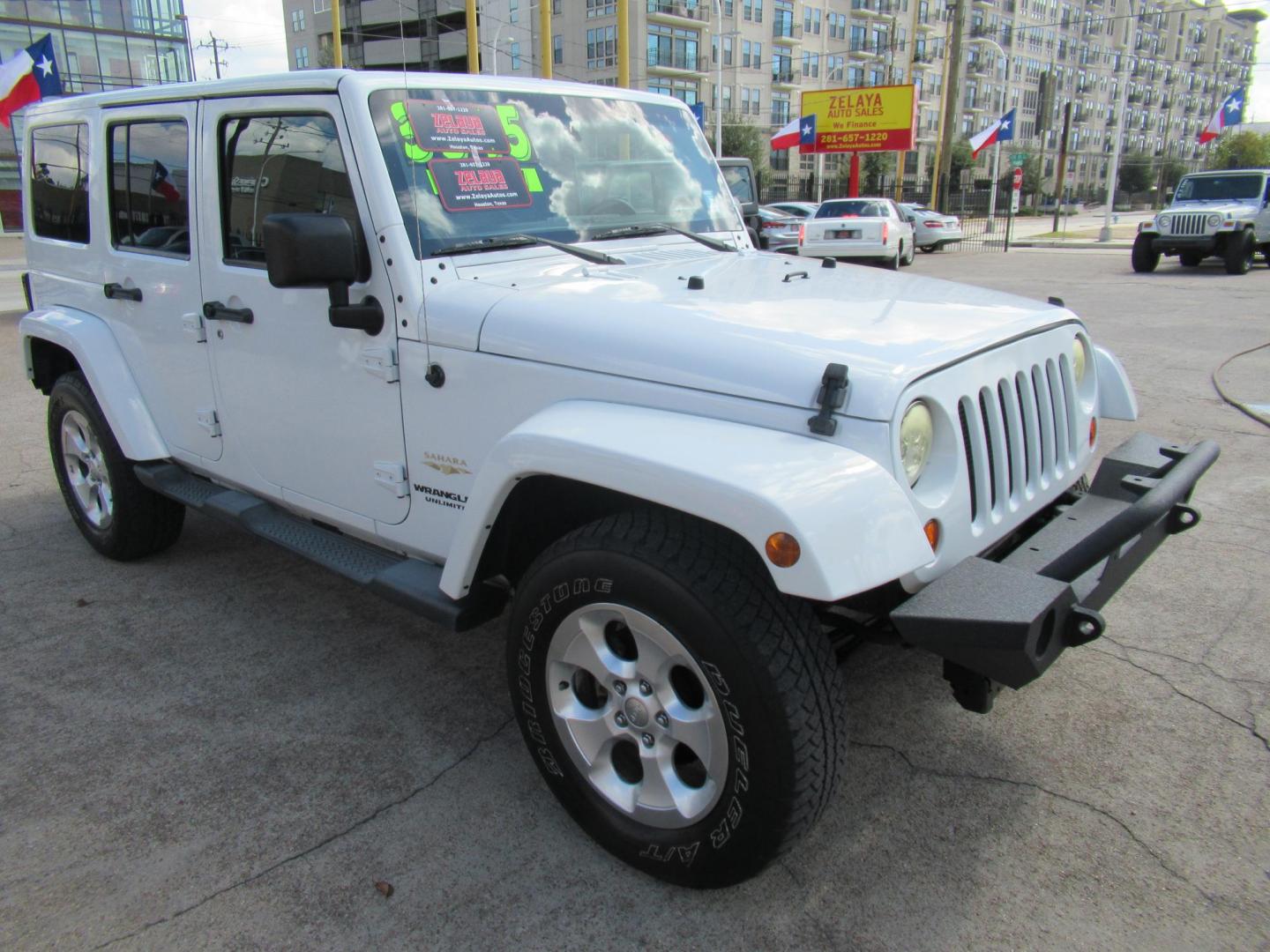 2013 White /Brown Jeep Wrangler Unlimited Sahara 4WD (1C4HJWEG7DL) with an 3.6L V6 DOHC 24V FFV engine, Automatic transmission, located at 1511 North Shepherd Dr., Houston, TX, 77008, (281) 657-1221, 29.798361, -95.412560 - 2013 JEEP WRANGLER UNLIMITED SAHARA VIN: 1C4HJWEG7DL579209 1 C 4 H J W E G 7 D L 5 7 9 2 0 9 4 DOOR WAGON/SPORT UTILITY 3.6L V6 F DOHC 24V GASOLINE REAR WHEEL DRIVE W/ 4X4 - Photo#12