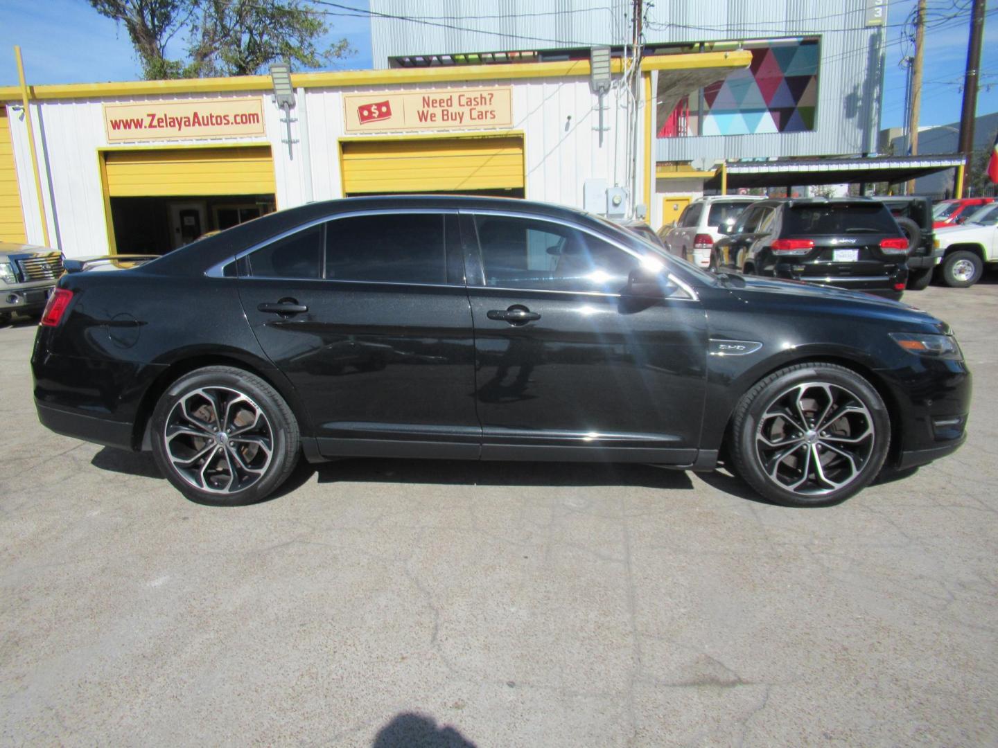 2013 Black /Black Ford Taurus SHO AWD (1FAHP2KT1DG) with an 3.5L V6 DOHC 24V engine, 6-Speed Automatic transmission, located at 1511 North Shepherd Dr., Houston, TX, 77008, (281) 657-1221, 29.798361, -95.412560 - 2013 FORD TAURUS SHO VIN: 1FAHP2KT1DG171926 1 F A H P 2 K T 1 D G 1 7 1 9 2 6 SEDAN 4 DR 3.5L V6 F DOHC 16V GASOLINE ALL WHEEL DRIVE - Photo#0