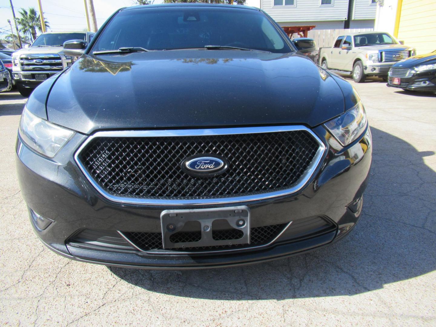 2013 Black /Black Ford Taurus SHO AWD (1FAHP2KT1DG) with an 3.5L V6 DOHC 24V engine, 6-Speed Automatic transmission, located at 1511 North Shepherd Dr., Houston, TX, 77008, (281) 657-1221, 29.798361, -95.412560 - 2013 FORD TAURUS SHO VIN: 1FAHP2KT1DG171926 1 F A H P 2 K T 1 D G 1 7 1 9 2 6 SEDAN 4 DR 3.5L V6 F DOHC 16V GASOLINE ALL WHEEL DRIVE - Photo#19