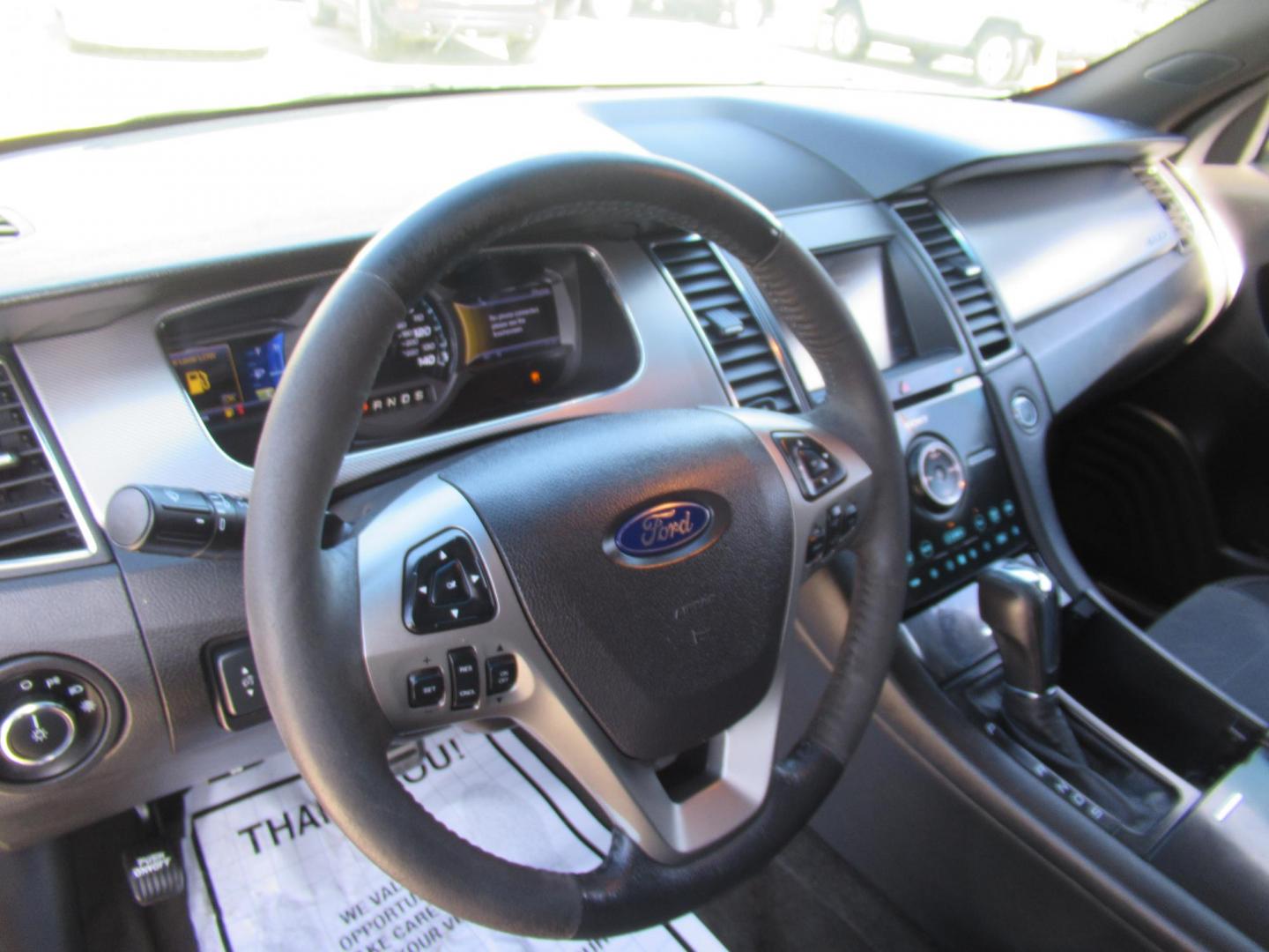 2013 Black /Black Ford Taurus SHO AWD (1FAHP2KT1DG) with an 3.5L V6 DOHC 24V engine, 6-Speed Automatic transmission, located at 1511 North Shepherd Dr., Houston, TX, 77008, (281) 657-1221, 29.798361, -95.412560 - 2013 FORD TAURUS SHO VIN: 1FAHP2KT1DG171926 1 F A H P 2 K T 1 D G 1 7 1 9 2 6 SEDAN 4 DR 3.5L V6 F DOHC 16V GASOLINE ALL WHEEL DRIVE - Photo#6