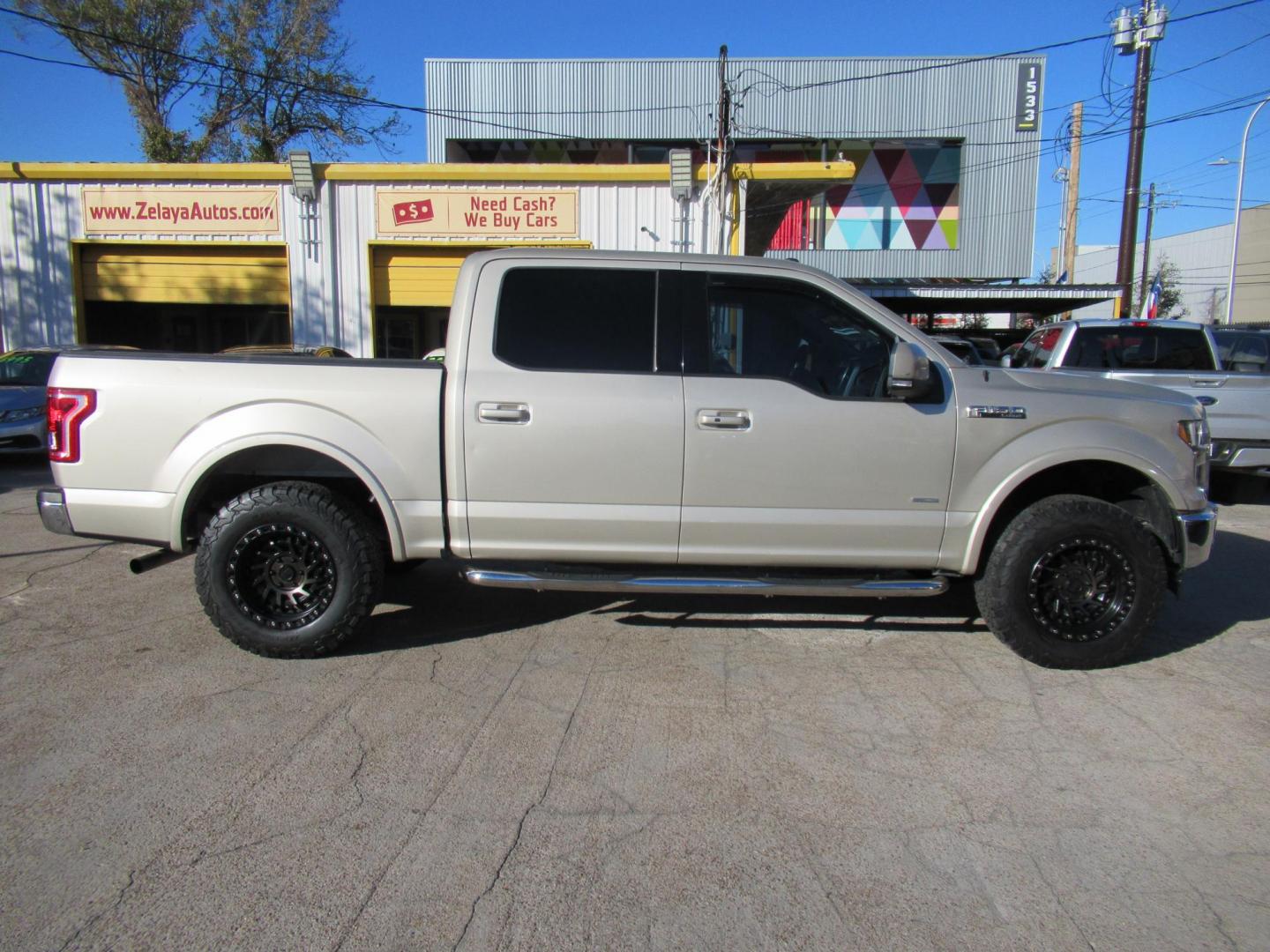 2017 Gold /Tan Ford F-150 Lariat SuperCrew 5.5-ft. Bed 4WD (1FTEW1EP6HF) with an 2.7L V6 DOHC 24V engine, Automatic transmission, located at 1511 North Shepherd Dr., Houston, TX, 77008, (281) 657-1221, 29.798361, -95.412560 - 2017 FORD F-150 LARIAT VIN: 1FTEW1EP6HFC50593 1 F T E W 1 E P 6 H F C 5 0 5 9 3 CREW PICKUP 2.7L V6 F DOHC 24V GASOLINE REAR WHEEL DRIVE W/ 4X4 - Photo#0