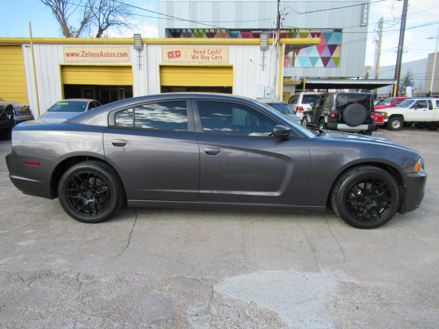 2014 Gray /Black Dodge Charger SE (2C3CDXBG0EH) with an 3.6L V6 DOHC 24V engine, 5-Speed Automatic transmission, located at 1511 North Shepherd Dr., Houston, TX, 77008, (281) 657-1221, 29.798361, -95.412560 - 2014 DODGE CHARGER SE VIN: 2C3CDXBG0EH188840 2 C 3 C D X B G 0 E H 1 8 8 8 4 0 SEDAN 4 DR 3.6L V6 F DOHC 24V GASOLINE REAR WHEEL DRIVE - Photo#0