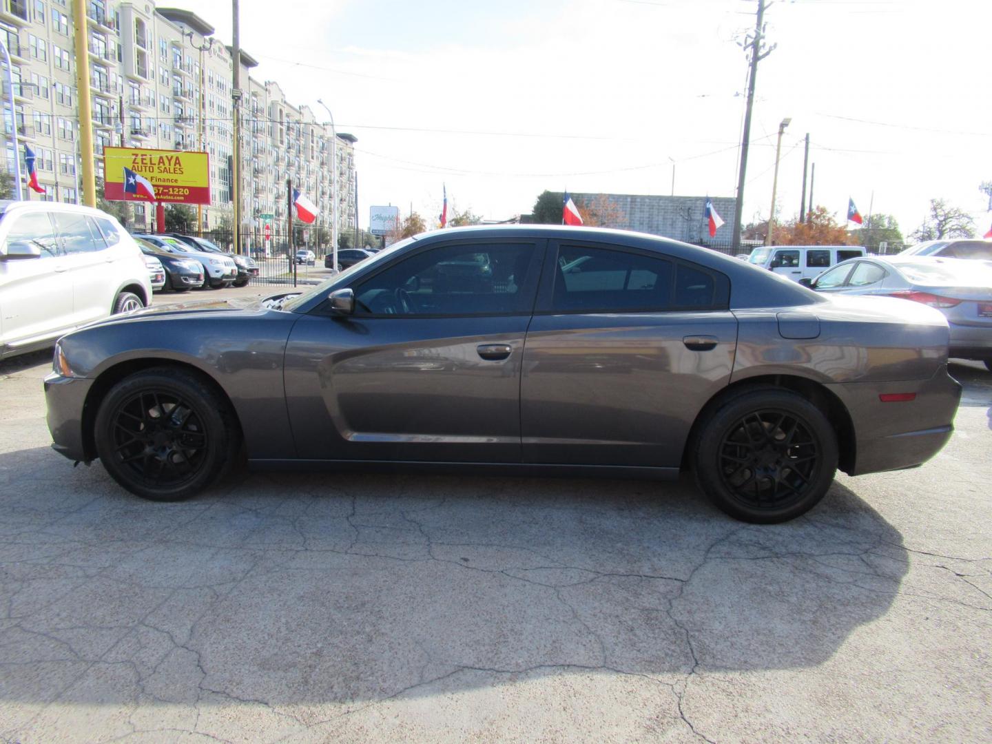 2014 Gray /Black Dodge Charger SE (2C3CDXBG0EH) with an 3.6L V6 DOHC 24V engine, 5-Speed Automatic transmission, located at 1511 North Shepherd Dr., Houston, TX, 77008, (281) 657-1221, 29.798361, -95.412560 - 2014 DODGE CHARGER SE VIN: 2C3CDXBG0EH188840 2 C 3 C D X B G 0 E H 1 8 8 8 4 0 SEDAN 4 DR 3.6L V6 F DOHC 24V GASOLINE REAR WHEEL DRIVE - Photo#19