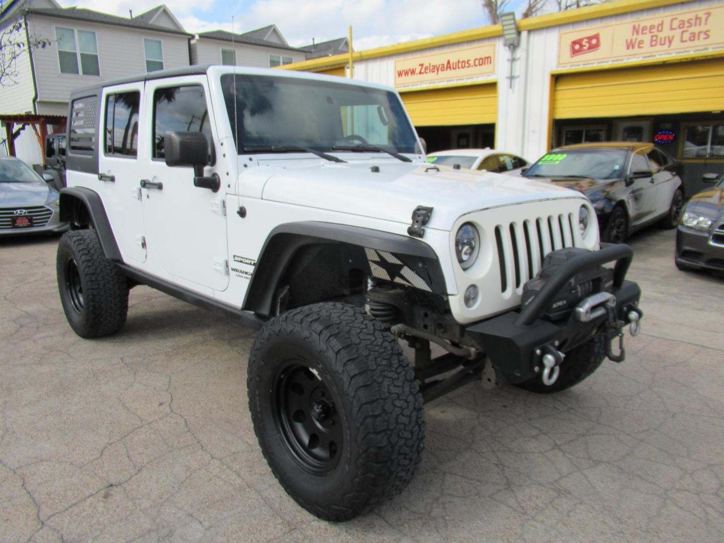 2017 White /Black Jeep Wrangler Unlimited Sport 4WD (1C4BJWDG4HL) with an 3.6L V6 DOHC 24V FFV engine, Manual transmission, located at 1511 North Shepherd Dr., Houston, TX, 77008, (281) 657-1221, 29.798361, -95.412560 - 2017 JEEP WRANGLER UNLIMITED SPORT VIN: 1C4BJWDG4HL597308 1 C 4 B J W D G 4 H L 5 9 7 3 0 8 4 DOOR WAGON/SPORT UTILITY 3.6L V6 F DOHC 24V GASOLINE REAR WHEEL DRIVE W/ 4X4 - Photo#0