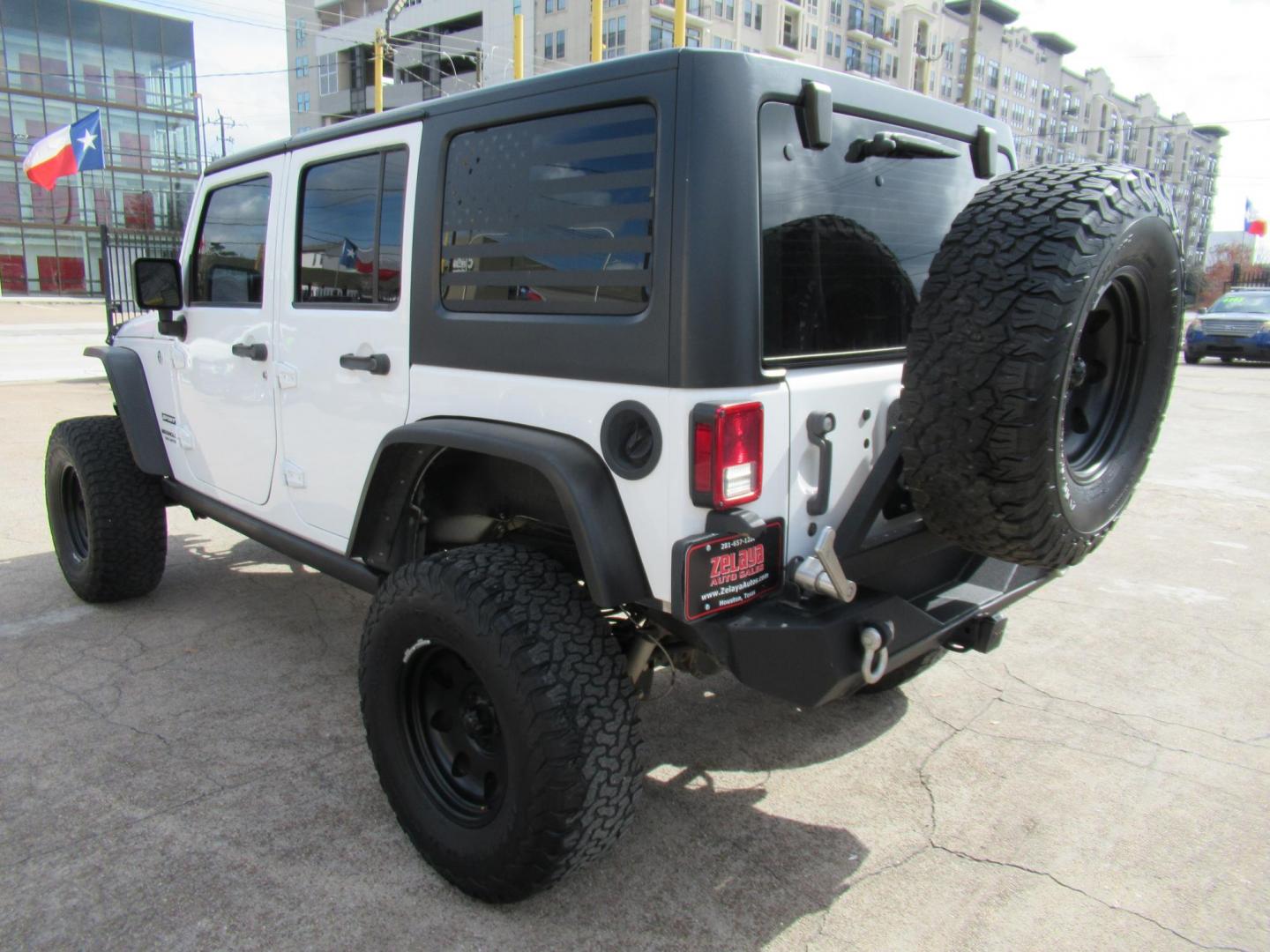 2017 White /Black Jeep Wrangler Unlimited Sport 4WD (1C4BJWDG4HL) with an 3.6L V6 DOHC 24V FFV engine, Manual transmission, located at 1511 North Shepherd Dr., Houston, TX, 77008, (281) 657-1221, 29.798361, -95.412560 - 2017 JEEP WRANGLER UNLIMITED SPORT VIN: 1C4BJWDG4HL597308 1 C 4 B J W D G 4 H L 5 9 7 3 0 8 4 DOOR WAGON/SPORT UTILITY 3.6L V6 F DOHC 24V GASOLINE REAR WHEEL DRIVE W/ 4X4 - Photo#1