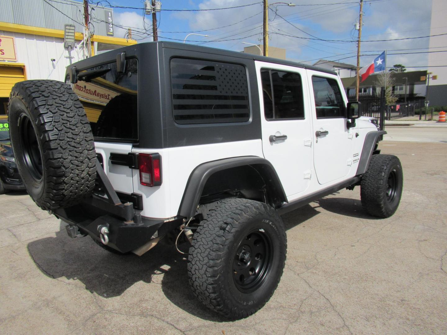 2017 White /Black Jeep Wrangler Unlimited Sport 4WD (1C4BJWDG4HL) with an 3.6L V6 DOHC 24V FFV engine, Manual transmission, located at 1511 North Shepherd Dr., Houston, TX, 77008, (281) 657-1221, 29.798361, -95.412560 - 2017 JEEP WRANGLER UNLIMITED SPORT VIN: 1C4BJWDG4HL597308 1 C 4 B J W D G 4 H L 5 9 7 3 0 8 4 DOOR WAGON/SPORT UTILITY 3.6L V6 F DOHC 24V GASOLINE REAR WHEEL DRIVE W/ 4X4 - Photo#3