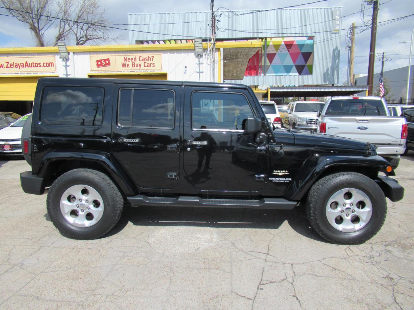 2015 Black /Black Jeep Wrangler Unlimited Sahara 4WD (1C4BJWEG8FL) with an 3.6L V6 DOHC 24V FFV engine, located at 1511 North Shepherd Dr., Houston, TX, 77008, (281) 657-1221, 29.798361, -95.412560 - 2015 JEEP WRANGLER UNLIMITED SAHARA VIN: 1C4BJWEG8FL723147 1 C 4 B J W E G 8 F L 7 2 3 1 4 7 4 DOOR WAGON/SPORT UTILITY 3.6L V6 F DOHC 24V GASOLINE REAR WHEEL DRIVE W/ 4X4 - Photo#0