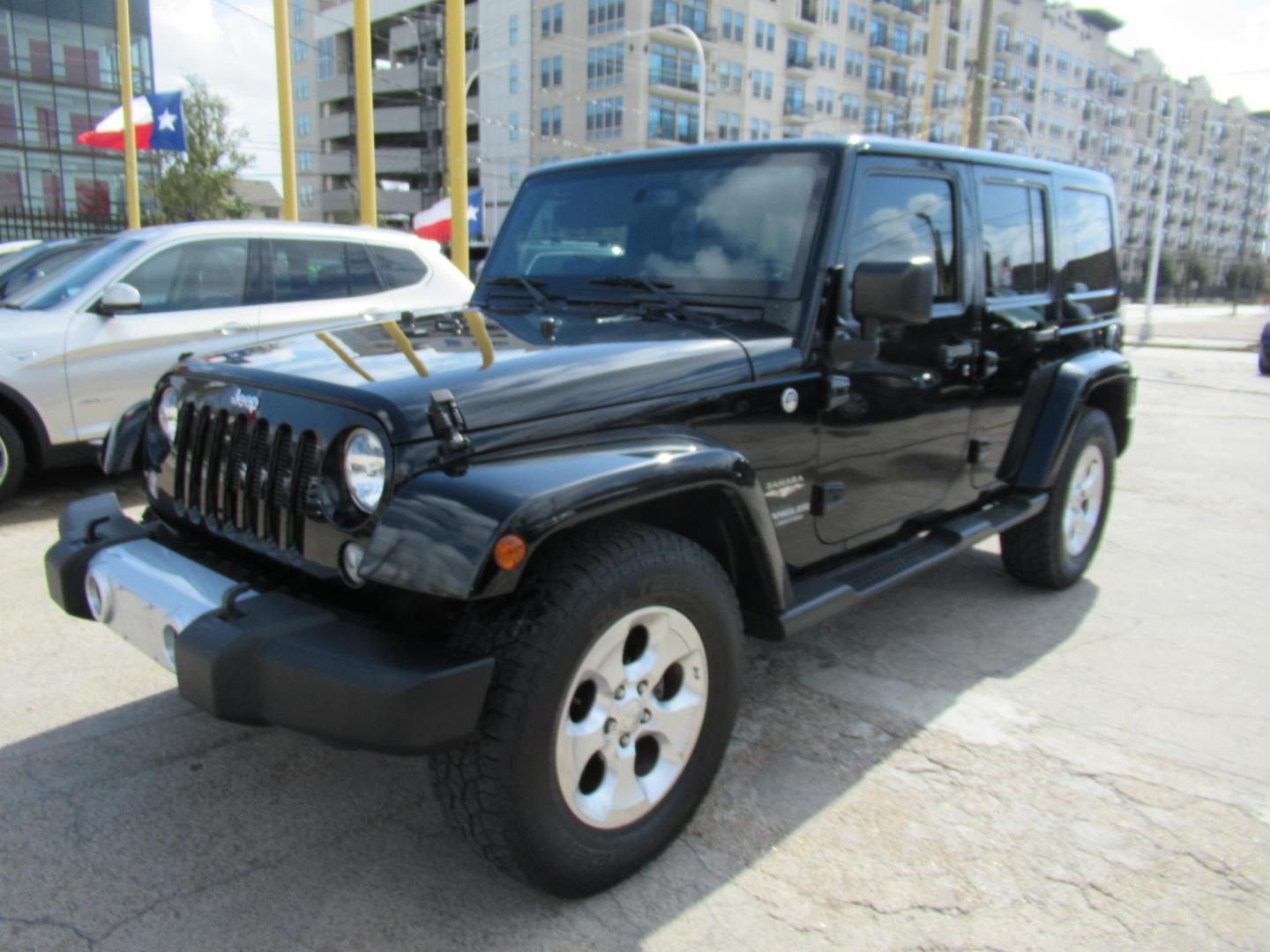 2015 Black /Black Jeep Wrangler Unlimited Sahara 4WD (1C4BJWEG8FL) with an 3.6L V6 DOHC 24V FFV engine, located at 1511 North Shepherd Dr., Houston, TX, 77008, (281) 657-1221, 29.798361, -95.412560 - 2015 JEEP WRANGLER UNLIMITED SAHARA VIN: 1C4BJWEG8FL723147 1 C 4 B J W E G 8 F L 7 2 3 1 4 7 4 DOOR WAGON/SPORT UTILITY 3.6L V6 F DOHC 24V GASOLINE REAR WHEEL DRIVE W/ 4X4 - Photo#1