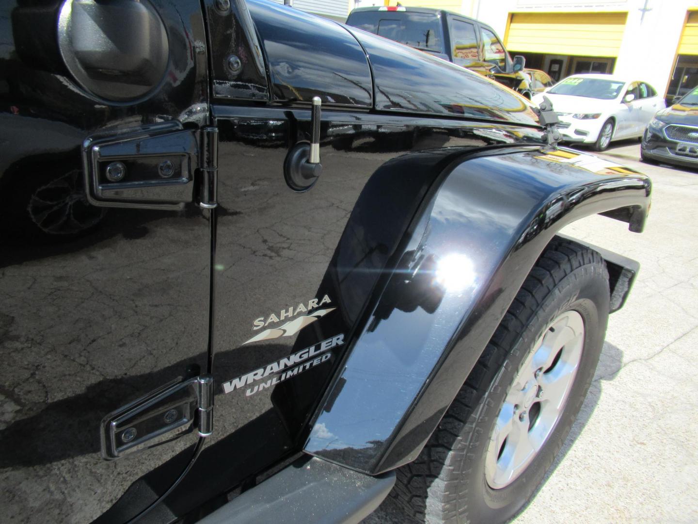 2015 Black /Black Jeep Wrangler Unlimited Sahara 4WD (1C4BJWEG8FL) with an 3.6L V6 DOHC 24V FFV engine, located at 1511 North Shepherd Dr., Houston, TX, 77008, (281) 657-1221, 29.798361, -95.412560 - 2015 JEEP WRANGLER UNLIMITED SAHARA VIN: 1C4BJWEG8FL723147 1 C 4 B J W E G 8 F L 7 2 3 1 4 7 4 DOOR WAGON/SPORT UTILITY 3.6L V6 F DOHC 24V GASOLINE REAR WHEEL DRIVE W/ 4X4 - Photo#14