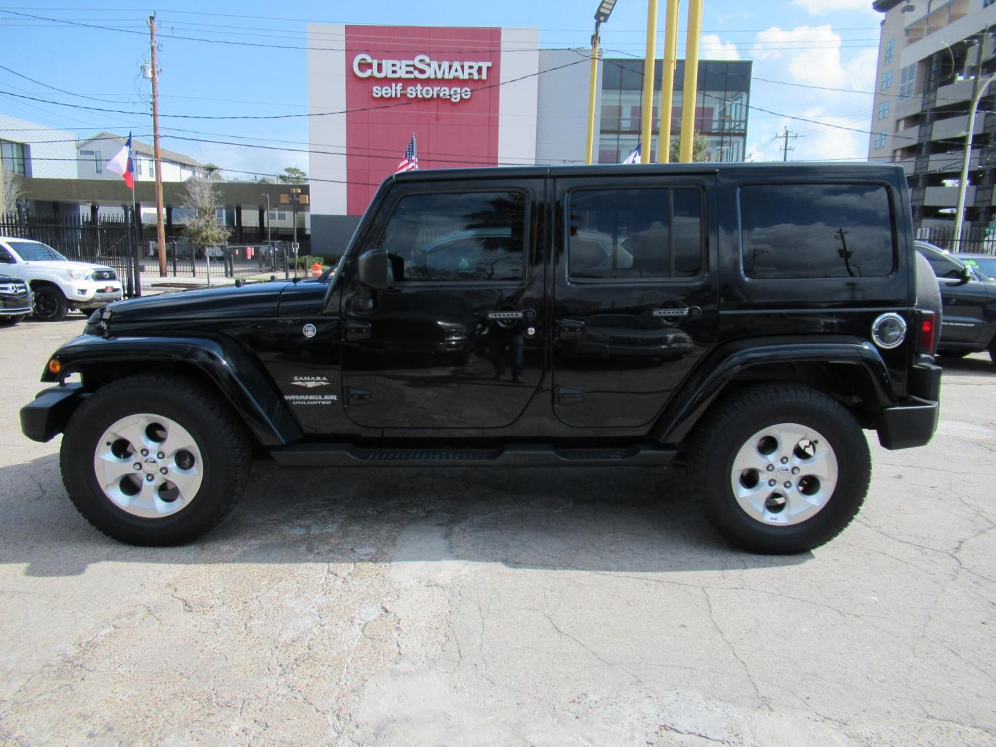 2015 Black /Black Jeep Wrangler Unlimited Sahara 4WD (1C4BJWEG8FL) with an 3.6L V6 DOHC 24V FFV engine, located at 1511 North Shepherd Dr., Houston, TX, 77008, (281) 657-1221, 29.798361, -95.412560 - 2015 JEEP WRANGLER UNLIMITED SAHARA VIN: 1C4BJWEG8FL723147 1 C 4 B J W E G 8 F L 7 2 3 1 4 7 4 DOOR WAGON/SPORT UTILITY 3.6L V6 F DOHC 24V GASOLINE REAR WHEEL DRIVE W/ 4X4 - Photo#2