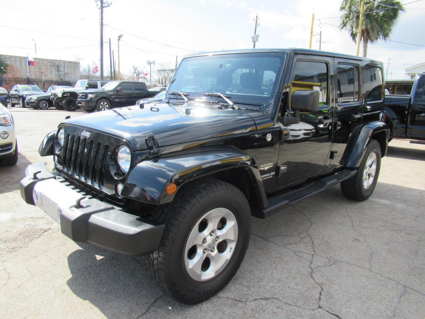 2015 Black /Black Jeep Wrangler Unlimited Sahara 4WD (1C4BJWEG8FL) with an 3.6L V6 DOHC 24V FFV engine, located at 1511 North Shepherd Dr., Houston, TX, 77008, (281) 657-1221, 29.798361, -95.412560 - 2015 JEEP WRANGLER UNLIMITED SAHARA VIN: 1C4BJWEG8FL723147 1 C 4 B J W E G 8 F L 7 2 3 1 4 7 4 DOOR WAGON/SPORT UTILITY 3.6L V6 F DOHC 24V GASOLINE REAR WHEEL DRIVE W/ 4X4 - Photo#21