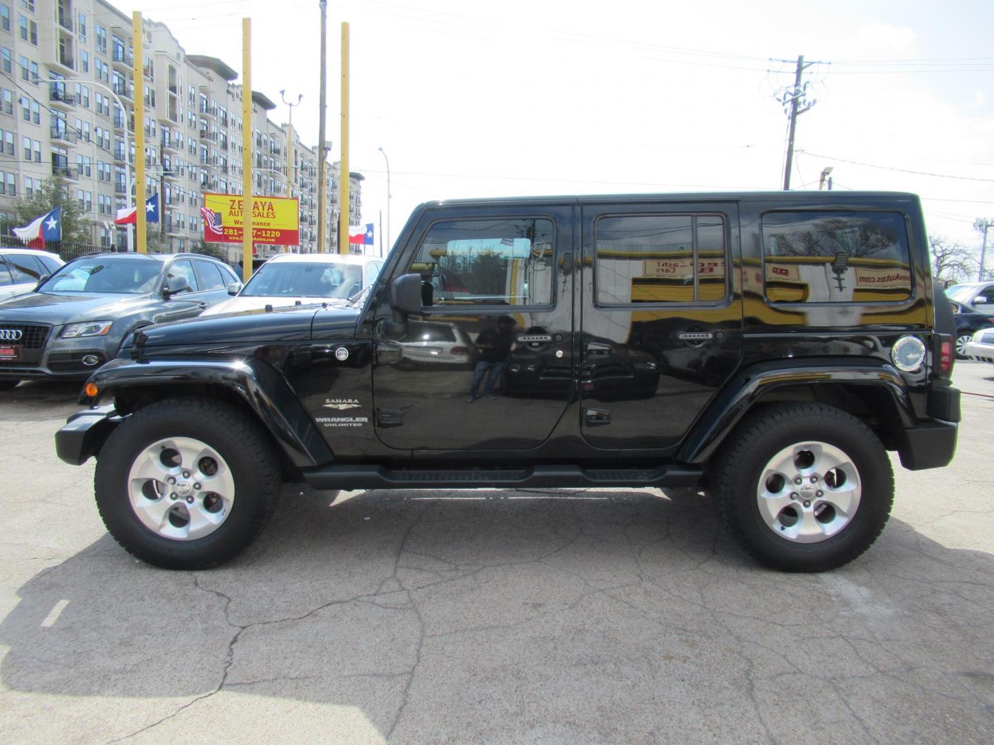 2015 Black /Black Jeep Wrangler Unlimited Sahara 4WD (1C4BJWEG8FL) with an 3.6L V6 DOHC 24V FFV engine, located at 1511 North Shepherd Dr., Houston, TX, 77008, (281) 657-1221, 29.798361, -95.412560 - 2015 JEEP WRANGLER UNLIMITED SAHARA VIN: 1C4BJWEG8FL723147 1 C 4 B J W E G 8 F L 7 2 3 1 4 7 4 DOOR WAGON/SPORT UTILITY 3.6L V6 F DOHC 24V GASOLINE REAR WHEEL DRIVE W/ 4X4 - Photo#22