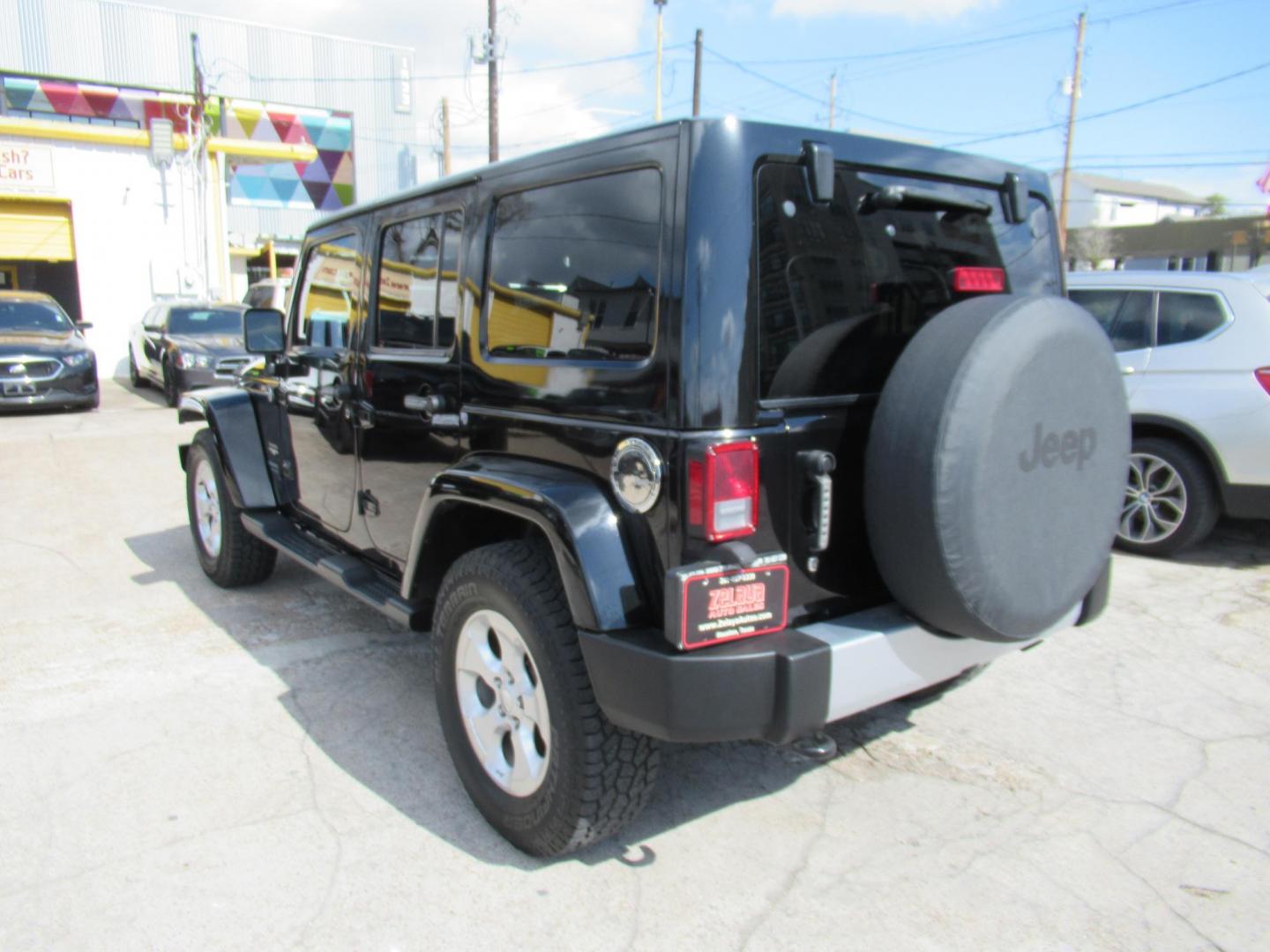 2015 Black /Black Jeep Wrangler Unlimited Sahara 4WD (1C4BJWEG8FL) with an 3.6L V6 DOHC 24V FFV engine, located at 1511 North Shepherd Dr., Houston, TX, 77008, (281) 657-1221, 29.798361, -95.412560 - 2015 JEEP WRANGLER UNLIMITED SAHARA VIN: 1C4BJWEG8FL723147 1 C 4 B J W E G 8 F L 7 2 3 1 4 7 4 DOOR WAGON/SPORT UTILITY 3.6L V6 F DOHC 24V GASOLINE REAR WHEEL DRIVE W/ 4X4 - Photo#3