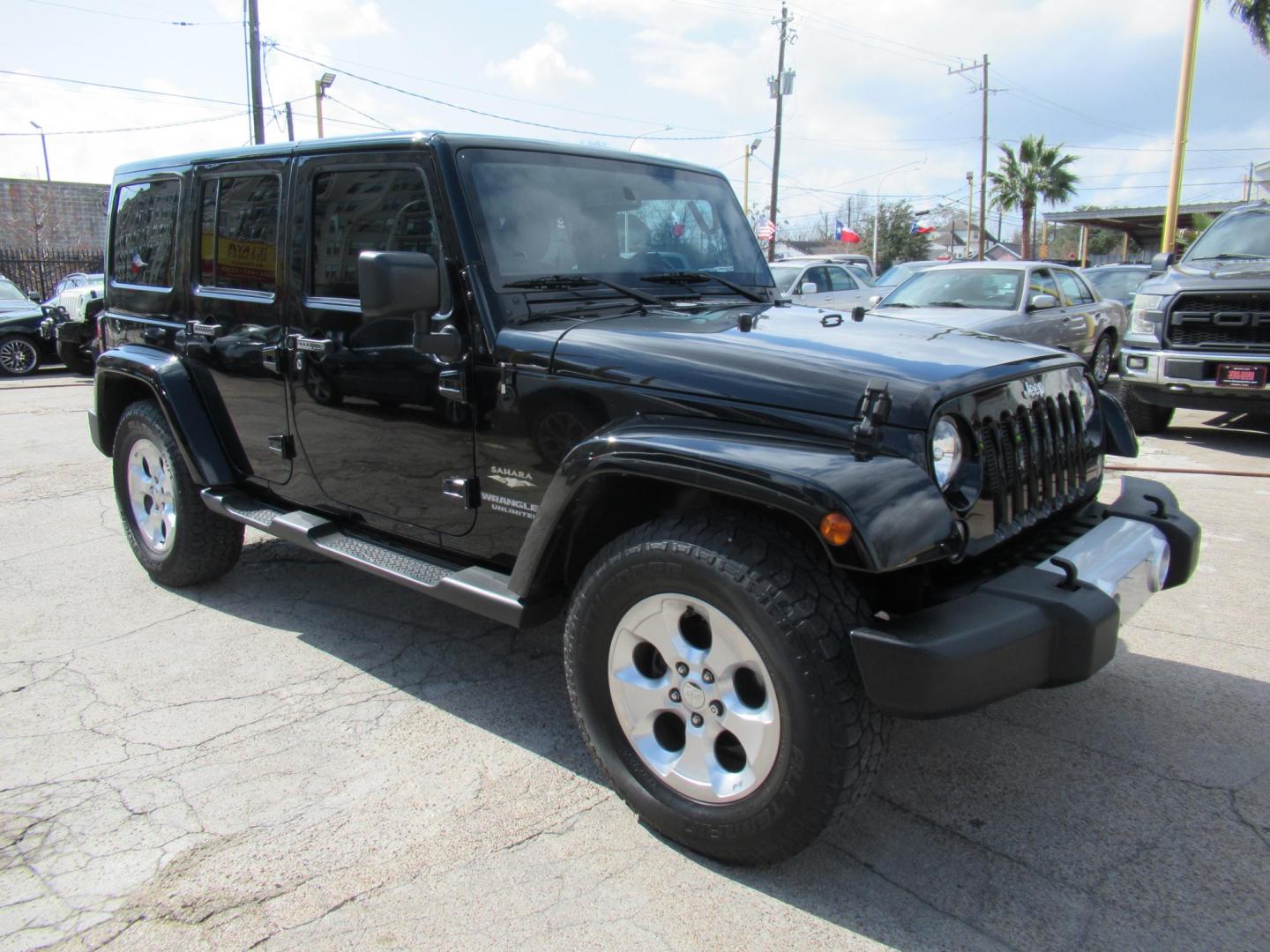 2015 Black /Black Jeep Wrangler Unlimited Sahara 4WD (1C4BJWEG8FL) with an 3.6L V6 DOHC 24V FFV engine, located at 1511 North Shepherd Dr., Houston, TX, 77008, (281) 657-1221, 29.798361, -95.412560 - 2015 JEEP WRANGLER UNLIMITED SAHARA VIN: 1C4BJWEG8FL723147 1 C 4 B J W E G 8 F L 7 2 3 1 4 7 4 DOOR WAGON/SPORT UTILITY 3.6L V6 F DOHC 24V GASOLINE REAR WHEEL DRIVE W/ 4X4 - Photo#6